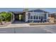 Inviting blue house boasts a covered carport and Southwestern-style landscaping at 5735 E Mcdowell Rd # 108, Mesa, AZ 85215