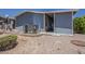 Exterior view of a home featuring a central air conditioning unit and desert landscaping at 5735 E Mcdowell Rd # 108, Mesa, AZ 85215