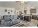 Open-concept living room flows into a modern kitchen with a center island and updated appliances at 5735 E Mcdowell Rd # 108, Mesa, AZ 85215