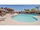 Inviting swimming pool with ample seating and shade structures at 5735 E Mcdowell Rd # 108, Mesa, AZ 85215