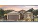 Charming single-story home featuring a two-car garage and desert landscaping at 5775 N Oak Creek Dr, Eloy, AZ 85131