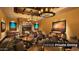Inviting fireside private dining area with desert themed artwork and comfortable seating at 5775 N Oak Creek Dr, Eloy, AZ 85131