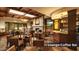 Cozy TV lounge featuring a stone fireplace, wooden accents, comfortable seating, and a coffee bar at 5775 N Oak Creek Dr, Eloy, AZ 85131