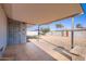 An inviting covered patio leads to a low maintenance backyard with block fencing and mature trees at 5827 N 22Nd Dr, Phoenix, AZ 85015