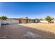 Low maintenance desert backyard with block fencing and multiple access points around the property at 5827 N 22Nd Dr, Phoenix, AZ 85015