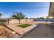 Fully fenced backyard featuring low-maintenance desert landscaping and a small patch of grass at 5827 N 22Nd Dr, Phoenix, AZ 85015