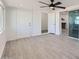 Spacious bedroom with tile floors, neutral paint, and access to dining and outdoor areas at 5827 N 22Nd Dr, Phoenix, AZ 85015