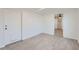 Bonus room with a large exterior door and a view into another room of the house at 5827 N 22Nd Dr, Phoenix, AZ 85015