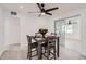 Dining area showcasing a modern table set with tile floors, and a view of the backyard at 5827 N 22Nd Dr, Phoenix, AZ 85015