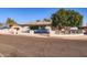 Charming single-story home featuring a low-walled front yard, mature shade tree, and inviting curb appeal at 5827 N 22Nd Dr, Phoenix, AZ 85015
