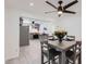 Open concept dining area with views to the gray cabinets and stainless-steel appliances in the kitchen at 5827 N 22Nd Dr, Phoenix, AZ 85015