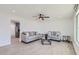 Bright living room with tile floors, neutral paint, ceiling fan and comfortable seating arrangement at 5827 N 22Nd Dr, Phoenix, AZ 85015