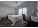 Bright bedroom with neutral decor, a bed with a soft coverlet, and plenty of natural light at 650 N Hawes Rd # 2819, Mesa, AZ 85207