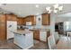 Open kitchen with wood cabinets, center island, and modern appliances, great for entertaining at 650 N Hawes Rd # 2819, Mesa, AZ 85207