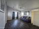 Relaxing living room with wood-look floors, comfortable seating, and neutral decor at 650 N Hawes Rd # 2819, Mesa, AZ 85207