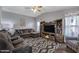 Comfortable living room with modern furniture, entertainment center, and stylish decor at 650 N Hawes Rd # 2819, Mesa, AZ 85207