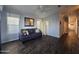 Inviting living room with modern furniture, neutral walls, and dark wood-look floors at 650 N Hawes Rd # 2819, Mesa, AZ 85207