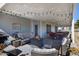 Spacious covered patio features a fire pit, seating, and string lights for evening relaxation at 650 N Hawes Rd # 2819, Mesa, AZ 85207