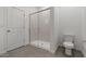 Bathroom featuring a glass enclosed shower and tile flooring next to the toilet at 7421 S 76Th Ln, Laveen, AZ 85339