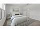 Bedroom featuring a plush bed with side tables and a decorative rug for added comfort at 7421 S 76Th Ln, Laveen, AZ 85339