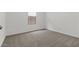 Bright bedroom featuring neutral carpet and a window that provides natural light at 7421 S 76Th Ln, Laveen, AZ 85339