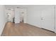Clean, modern entryway with wood-look flooring and views into other rooms at 7421 S 76Th Ln, Laveen, AZ 85339