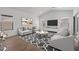 Spacious living room with ample natural light, showcasing modern decor and comfortable seating arrangement at 7421 S 76Th Ln, Laveen, AZ 85339