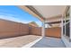 Covered patio with block wall, offering private space for outdoor relaxation and entertainment at 7421 S 76Th Ln, Laveen, AZ 85339