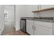 Convenient wet bar area with granite countertops, modern fixtures, and a mini-fridge at 7421 S 76Th Ln, Laveen, AZ 85339