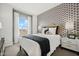 Cozy bedroom with patterned wallpaper and stylish decor at 7454 S 75Th Dr, Laveen, AZ 85339