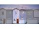 Modern townhome featuring a private garage and inviting front entrance at 7454 S 75Th Dr, Laveen, AZ 85339