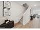 Inviting hallway with staircase, stylish decor, and access to living areas at 7454 S 75Th Dr, Laveen, AZ 85339