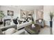 Comfortable living room features neutral furniture and an open floor plan at 7454 S 75Th Dr, Laveen, AZ 85339