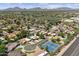 Residential neighborhood view with lush landscaping and a tennis court, highlighting a community at 7835 E Cannon Dr, Scottsdale, AZ 85258