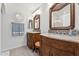 Elegant bathroom with dual vanities, decorative mirrors, and upscale fixtures at 7835 E Cannon Dr, Scottsdale, AZ 85258