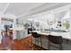 Stylish kitchen with modern appliances, a breakfast bar, and hardwood floors at 7835 E Cannon Dr, Scottsdale, AZ 85258