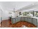 A kitchen with light gray cabinets and quartz countertops that face a large bay window at 7835 E Cannon Dr, Scottsdale, AZ 85258