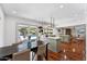 Open concept kitchen with center island, eat in dining table and chairs, and access to backyard pool at 7835 E Cannon Dr, Scottsdale, AZ 85258
