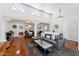 Bright living room with soaring ceilings, wood floors, and elegant columns at 7835 E Cannon Dr, Scottsdale, AZ 85258