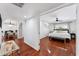 The main bedroom features hardwood floors, a ceiling fan, and lots of natural light at 7835 E Cannon Dr, Scottsdale, AZ 85258