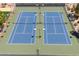 Aerial view of a community tennis court shows well-maintained blue courts at 7835 E Cannon Dr, Scottsdale, AZ 85258