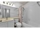 Bathroom has a sink, toilet, mirror, and a bathtub with a shower at 823 W Kyle Ct, Gilbert, AZ 85233