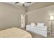 Bedroom with neutral walls, a daybed, and ensuite bathroom door at 823 W Kyle Ct, Gilbert, AZ 85233