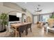 Living and dining areas featuring tiled floors, neutral paint, and contemporary furnishings at 823 W Kyle Ct, Gilbert, AZ 85233