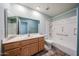 Bathroom featuring a sink vanity, a toilet, and a bathtub with a shower head at 8303 E Monterey Ave, Mesa, AZ 85209