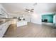Bright, open kitchen with white cabinets, stainless steel appliances, and a spacious island at 8303 E Monterey Ave, Mesa, AZ 85209