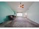 Cozy living room with fan, neutral walls, and plush carpet, creating a comfortable atmosphere at 8303 E Monterey Ave, Mesa, AZ 85209