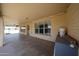 Covered patio with brick walls, recessed lighting, and ample space for entertaining at 8303 E Monterey Ave, Mesa, AZ 85209