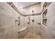 Tiled shower with a built-in bench and mosaic tile accents at 8303 E Monterey Ave, Mesa, AZ 85209