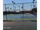 Well-maintained tennis court offers residents a great way to stay active and enjoy the outdoors at 8303 E Monterey Ave, Mesa, AZ 85209